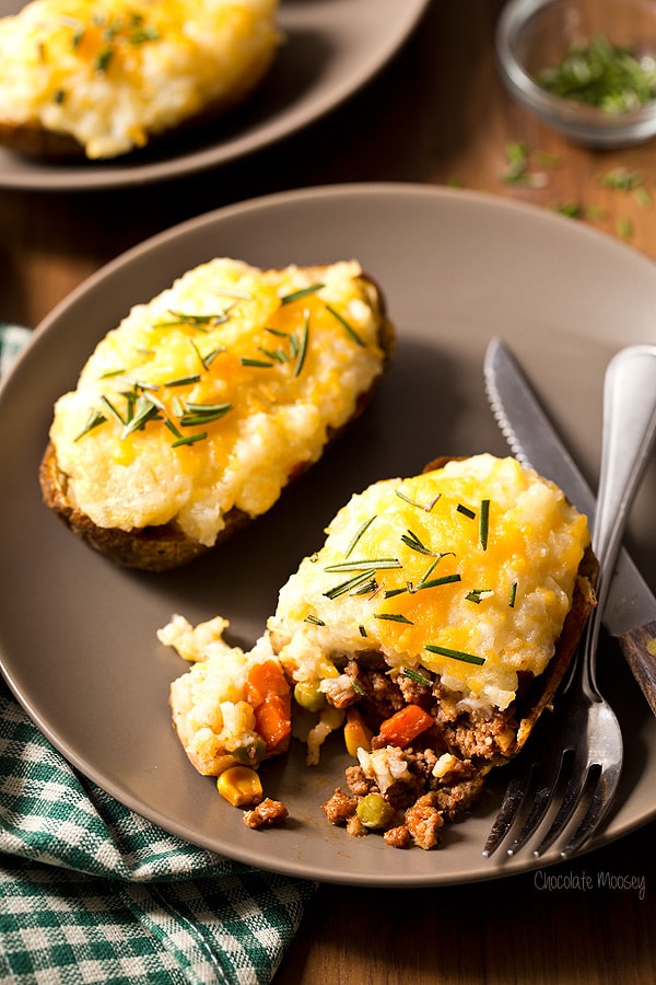 Shepherd's Pie Baked Potatoes cut open on a plate