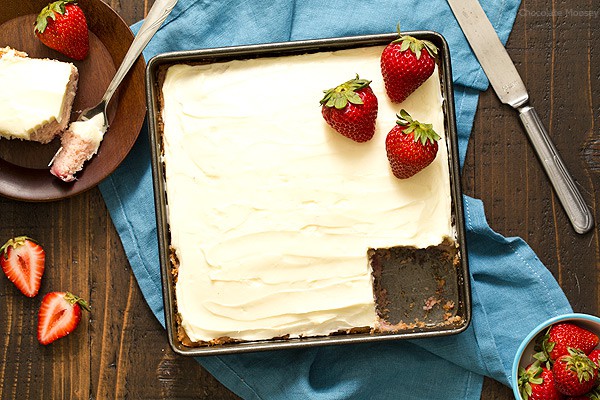 Strawberry Snack Cake in 8x8 pan with piece missing