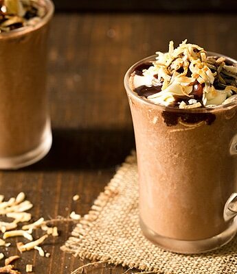 One sip of Toasted Coconut Frozen Hot Chocolate made with coconut milk and you'll be whisked away to paradise. Easily makes two drinks in a blender.