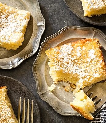 No need to drive to St. Louis when you're craving St Louis Gooey Butter Cake - a flat, dense cake with gooey, buttery center topped with a touch of powdered sugar. Grab your fork and dig it!
