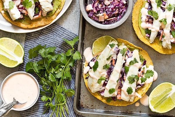 Sweet Chili Fish Tostadas topped with guacamole, sweet chili slaw, and flaky white fish make an easy summertime meal.