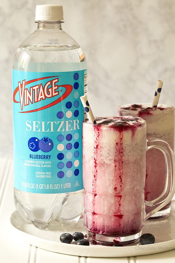 Enjoy summer in a glass with Blueberry Cream Soda Floats made with homemade blueberry soda and vanilla ice cream.