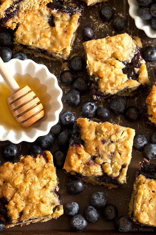 Soft, moist, and reminiscent of oatmeal cookies, Honey Blueberry Oatmeal Bars are filled with a homemade blueberry honey jam without pectin.