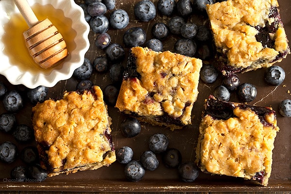 Soft, moist, and reminiscent of oatmeal cookies, Honey Blueberry Oatmeal Bars are filled with a homemade blueberry honey jam without pectin.
