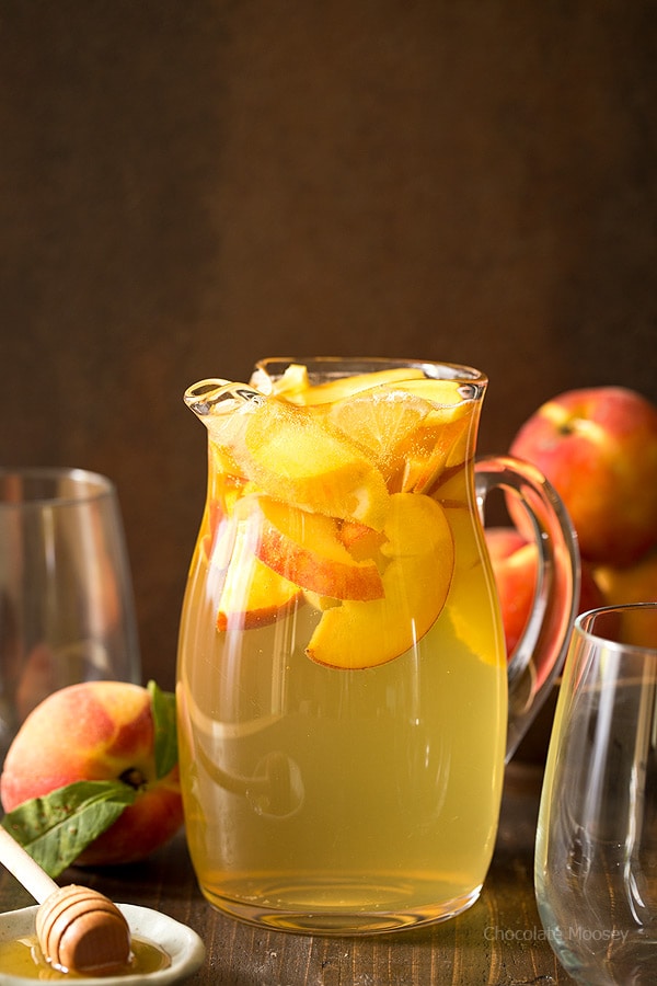 Summer is for sipping sangria: Peach Honey Sangria made with white wine, fresh peaches, and honey