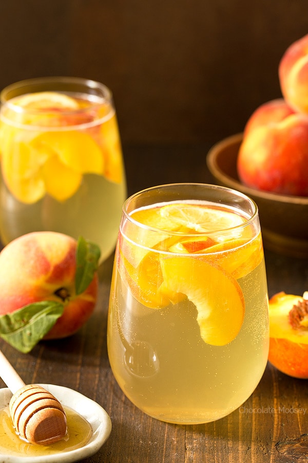 Summer is for sipping sangria: Peach Honey Sangria made with white wine, fresh peaches, and honey