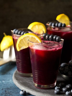 Ditch the drink mix and make a refreshing pitcher of homemade Sparkling Blueberry Lemonade from freshly squeezed lemons and a homemade blueberry syrup.