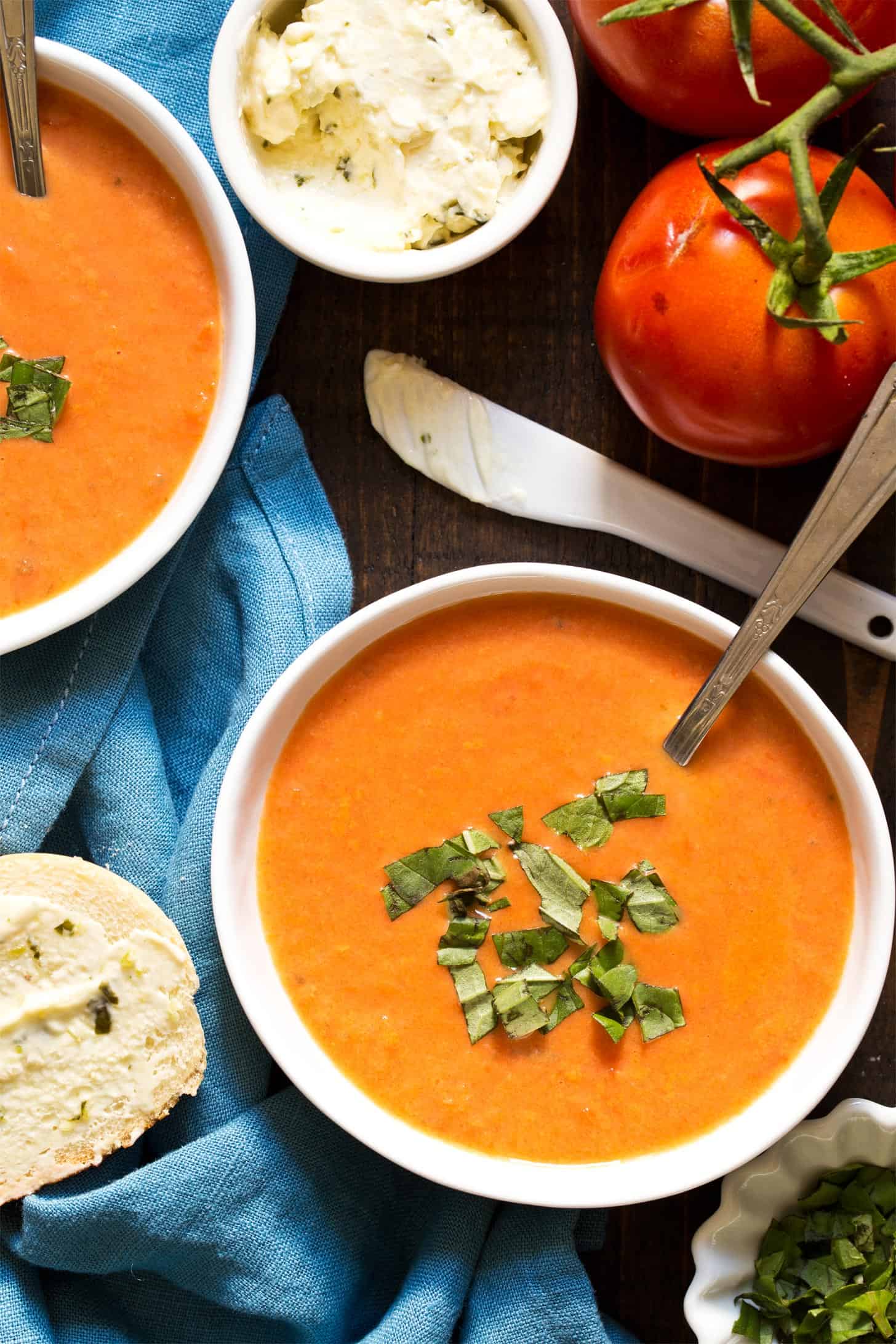 Tomato soup recipe with fresh tomatoes served in white bowls