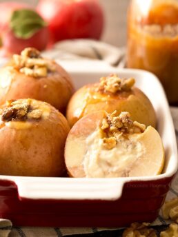Cheesecake Stuffed Apples in red casserole dish