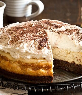Looking for a caffeine boost? You're going to need a slice of Mocha Brownie Cheesecake with coffee whipped cream to go along with your cup of coffee.