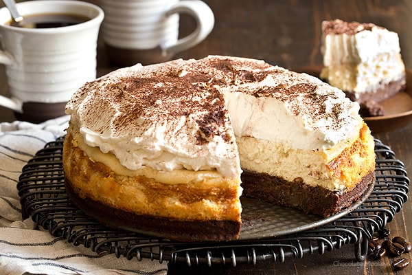 Looking for a caffeine boost? You're going to need a slice of Mocha Brownie Cheesecake with coffee whipped cream to go along with your cup of coffee.