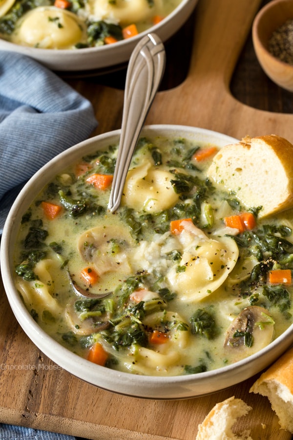 When there's a chill in the air, that means it's time for One Pot Spinach Mushroom Dumpling Soup - a hearty and filling dinner ready from prep to table in under 60 minutes. Made with spinach, mushrooms, carrots, and pelmeni dumplings.