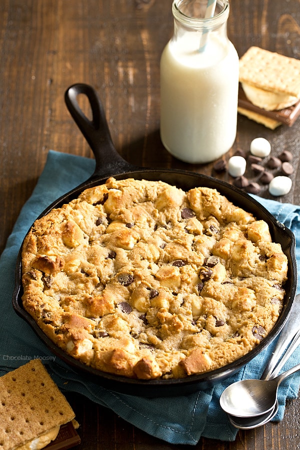 The taste of s'mores right from your oven! Peanut Butter S'mores Chocolate Chip Skillet Cookie combines graham crackers, toasted marshmallows, chocolate chips, and peanut butter into one heavenly dessert.