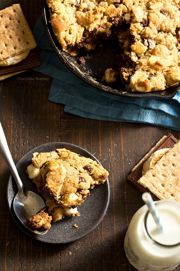 The taste of s'mores right from your oven! Peanut Butter S'mores Chocolate Chip Skillet Cookie combines graham crackers, toasted marshmallows, chocolate chips, and peanut butter into one heavenly dessert.