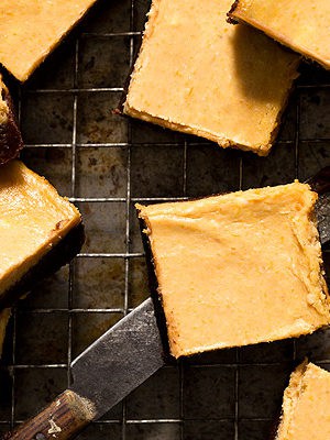 When two desserts become one with a fall twist - Pumpkin Cheesecake Brownies with a chocolate cinnamon brownie bottom and a creamy pumpkin layer on top.