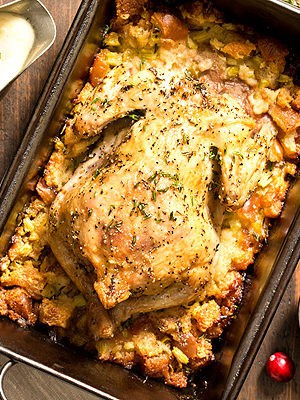 Roasted Cornish hen in pan with stuffing