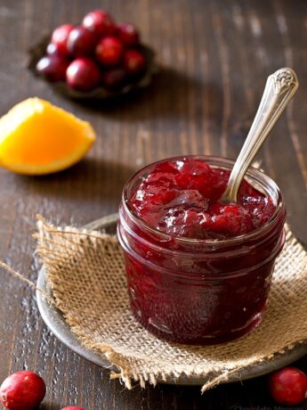 Small batch cranberry sauce in a jar with a spoon