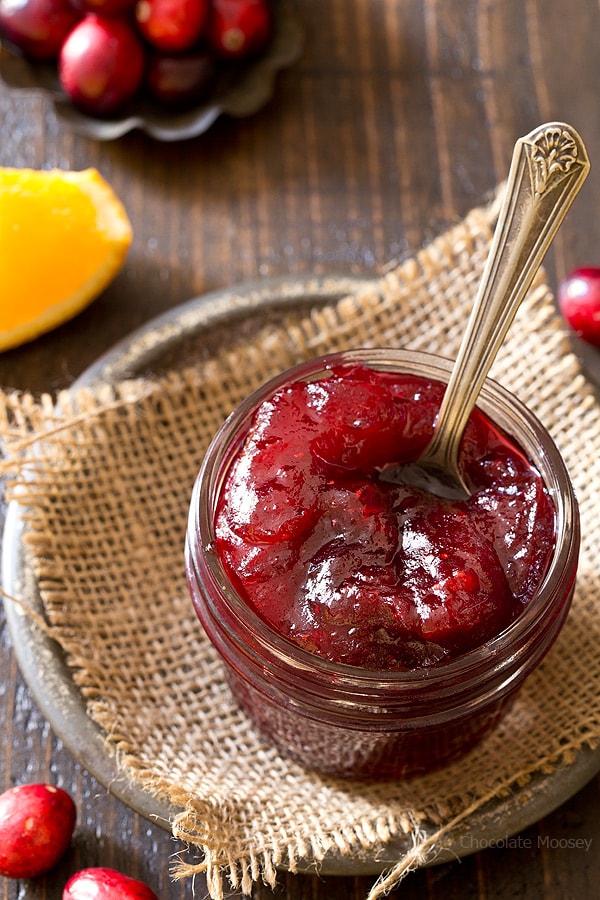 Fresh cranberry sauce in a jar with a spoon