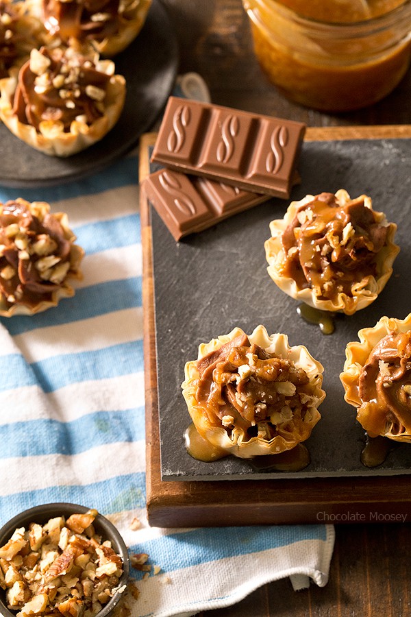 Looking for a bite-sized dessert to share with family and friends? These easy-to-serve No Bake Turtle Cheesecake Phyllo Cups with chocolate, caramel, and pecans will be a popular hit! 