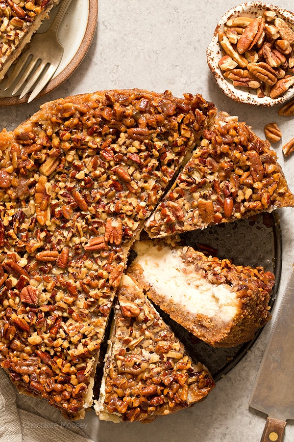 Pecan Pie Cheesecake cut into slices with one slice on its side
