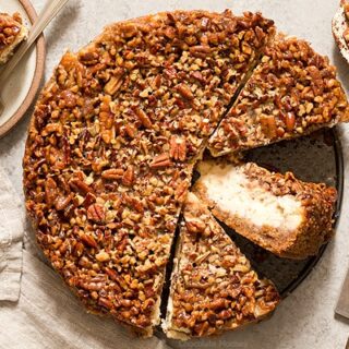 Pecan Pie Cheesecake cut into slices with one slice on its side