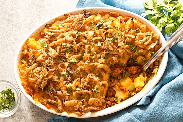 Homemade Cheesy Chorizo Potatoes made from scratch without canned soup doubles as both dinner and brunch. Elegant enough for the holidays yet casual enough for family dinner. Top them with French fried onions for a flavorful crunch.