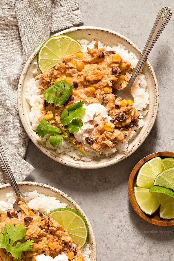 Warm and spicy small scale Slow Cooker Salsa Chicken served over rice with cilantro and lime. Recipe is scaled down to make 4 servings, enough to realistically feed 2 people. 