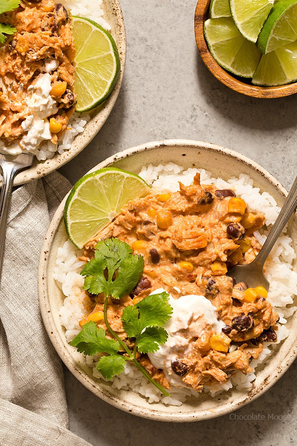 Warm and spicy small scale Slow Cooker Salsa Chicken served over rice with cilantro and lime. Recipe is scaled down to make 4 servings, enough to realistically feed 2 people.