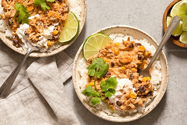 Warm and spicy small scale Slow Cooker Salsa Chicken served over rice with cilantro and lime. Recipe is scaled down to make 4 servings, enough to realistically feed 2 people.