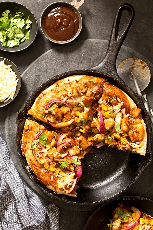 Buying pizza can add up, but luckily you can make it at home with BBQ Chicken Skillet Pizza for two. No need to worry about rolling homemade pizza dough into a perfect circle because you shape the dough inside a cast iron skillet.