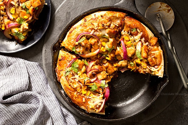 Buying pizza can add up, but luckily you can make it at home with BBQ Chicken Skillet Pizza for two. No need to worry about rolling homemade pizza dough into a perfect circle because you shape the dough inside a cast iron skillet.