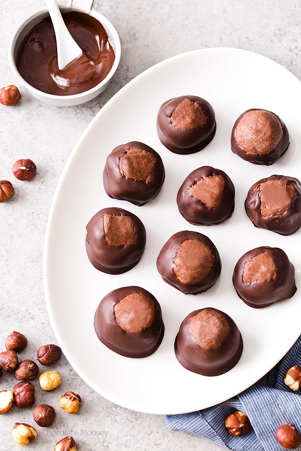 Break away from tradition and serve these Chocolate Hazelnut Buckeyes at your next party! The filling is made with chocolate hazelnut spread, giving this sweet treat a double dose of chocolate.