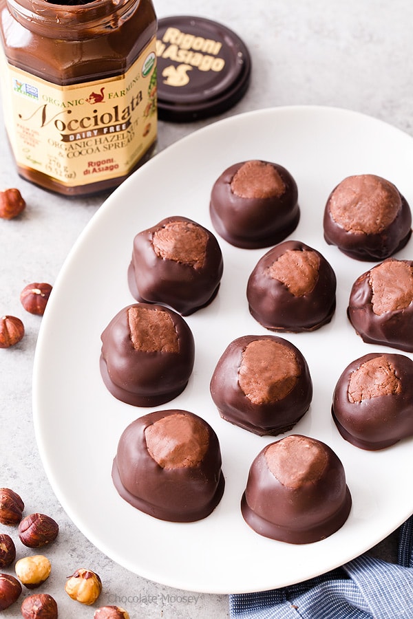 Break away from tradition and serve these Chocolate Hazelnut Buckeyes at your next party! The filling is made with chocolate hazelnut spread, giving this sweet treat a double dose of chocolate.