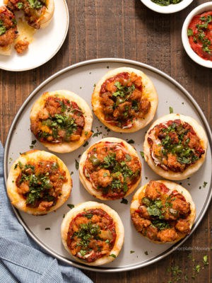 Serving pizza is popular for a party, but sometimes you don't have room for a whole slice. Problem solved with these Italian Sausage Pizza Bites, which are mini pizzas topped with a homemade pizza sauce, mozzarella cheese, and hot Italian sausage with peppers.