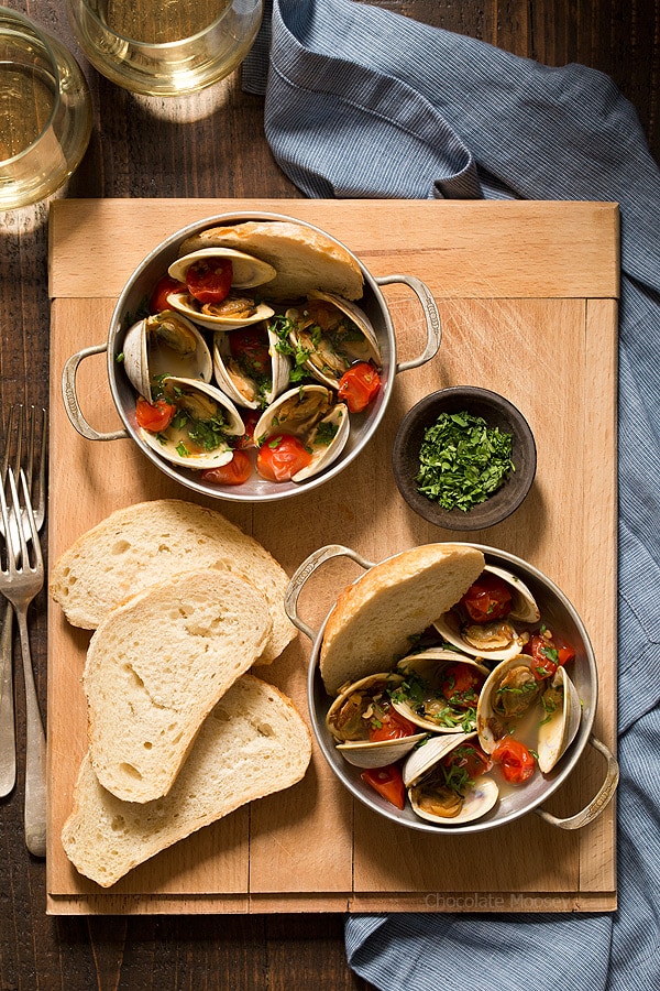 Learn how to make Steamed Clams with Pan Roasted Tomatoes as an easy date night appetizer to make at home! This recipe makes enough to serve two people, ideal for Valentine’s Day, anniversaries, birthdays, and days off together.