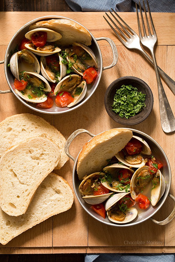 Learn how to make Steamed Clams with Pan Roasted Tomatoes as an easy date night appetizer to make at home! This recipe makes enough to serve two people, ideal for Valentine’s Day, anniversaries, birthdays, and days off together.