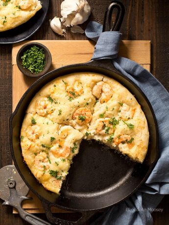 Turn pizza night at home into a special date night dinner with Shrimp Scampi Skillet Pizza For Two with a white wine garlic butter sauce and homemade pizza dough. Ideal for Valentine’s Day, anniversaries, birthdays, and days off together.