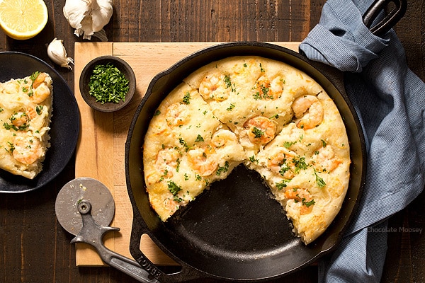 Turn pizza night at home into a special date night dinner with Shrimp Scampi Skillet Pizza For Two with a white wine garlic butter sauce and homemade pizza dough. Ideal for Valentine’s Day, anniversaries, birthdays, and days off together.