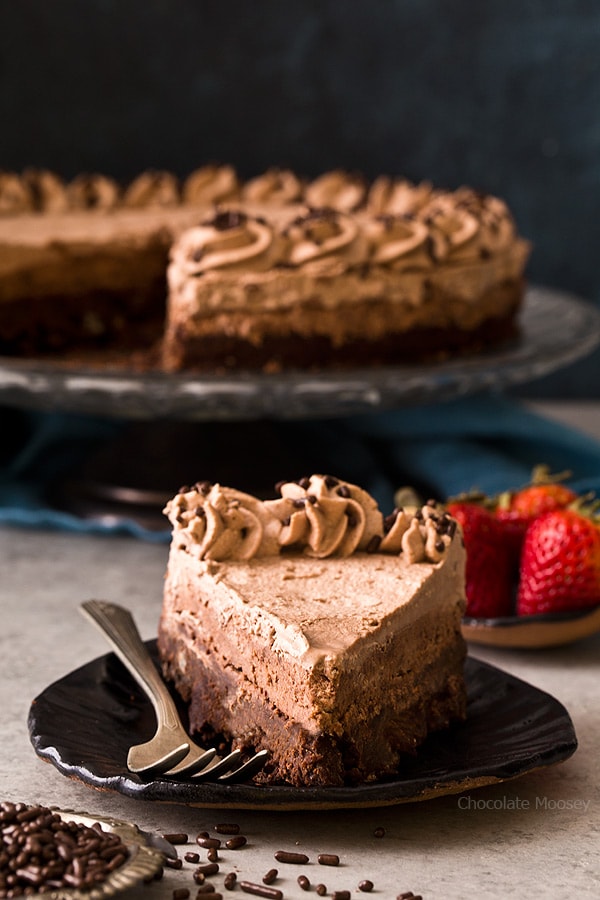 Slice of Brownie Bottom Chocolate Mousse Cake with chocolate whipped cream