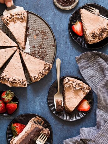 Serving slices of Brownie Bottom Chocolate Mousse Cake with chocolate whipped cream