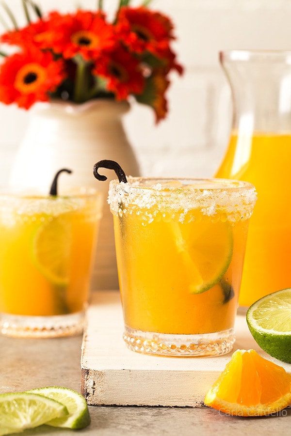 Orange Vanilla Margaritas are made with fresh orange juice, lime juice, and vanilla bean. Recipe makes two drinks.