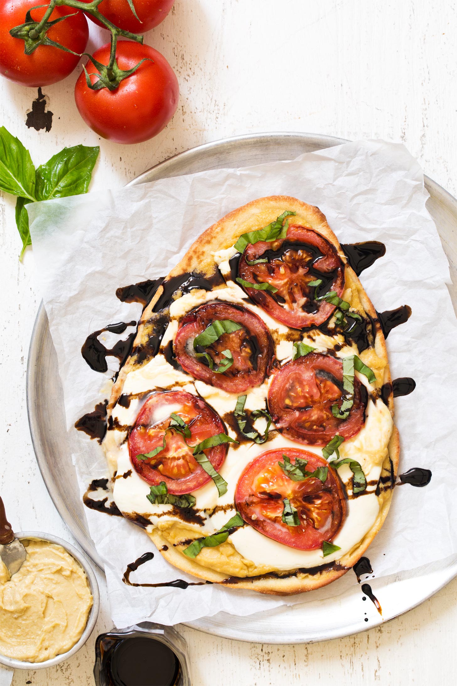 Whole hummus pizza uncut