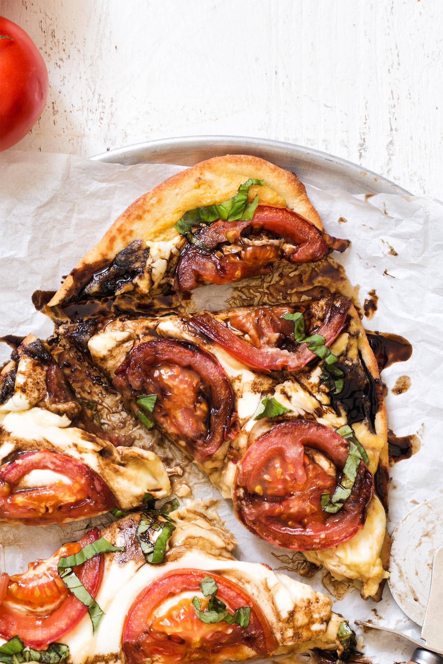 Close up of caprese pizza with hummus