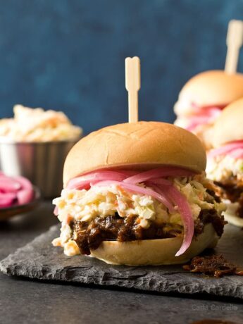 In the mood for barbecue but don't want to turn on the oven? These small batch Slow Cooker Shredded Beef Sliders with an easy homemade barbecue sauce and coleslaw will do the trick!
