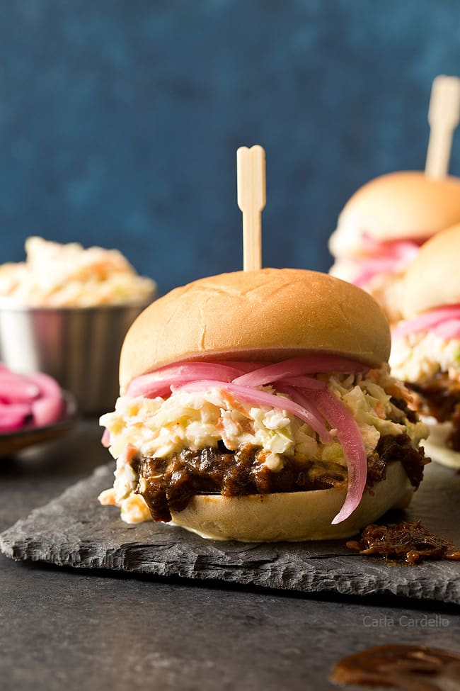 In the mood for barbecue but don't want to turn on the oven? These small batch Slow Cooker Shredded Beef Sliders with an easy homemade barbecue sauce and coleslaw will do the trick!