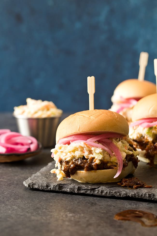 In the mood for barbecue but don't want to turn on the oven? These small batch Slow Cooker Shredded Beef Sliders with an easy homemade barbecue sauce and coleslaw will do the trick!