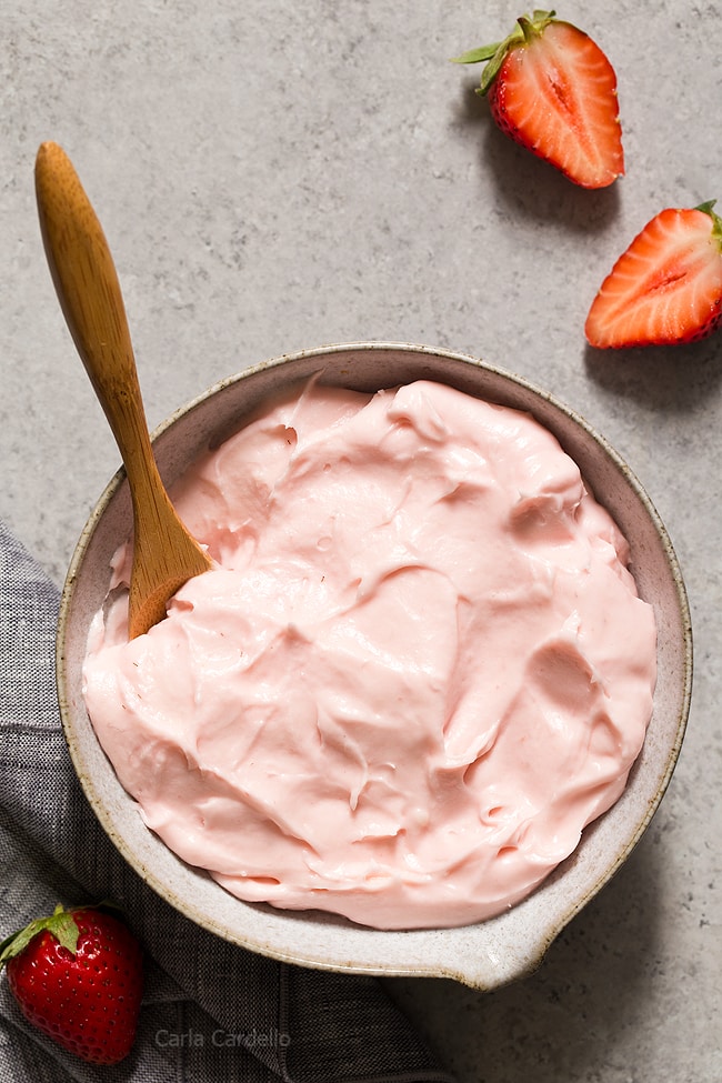 Bowl of pink strawberry cream cheese frosting