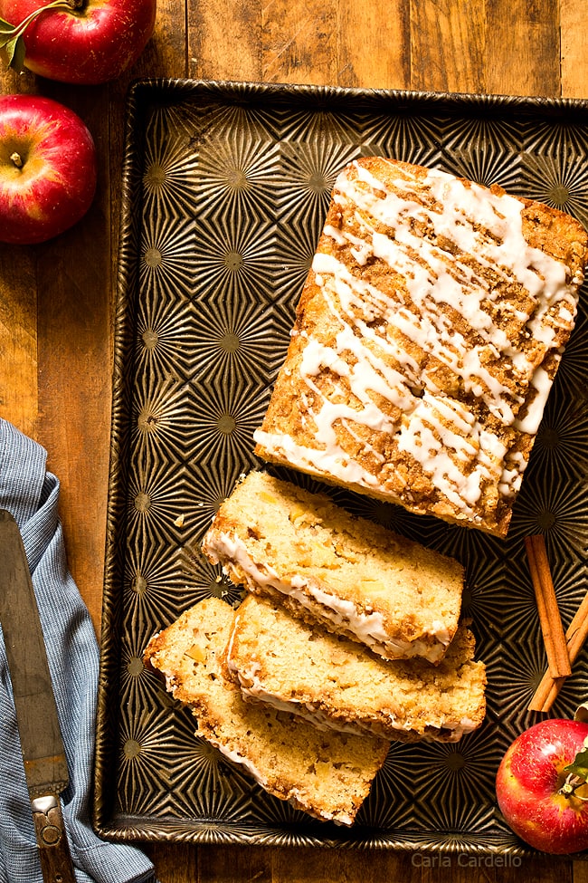 Warm up your kitchen for fall baking with Cinnamon Apple Bread topped with cinnamon streusel and a simple white icing.