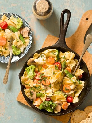 Get your daily serving of vegetables with One Skillet Pasta Primavera with a creamy Parmesan sauce! Customize your dinner by adding chicken, shrimp, and/or your favorite vegetables.