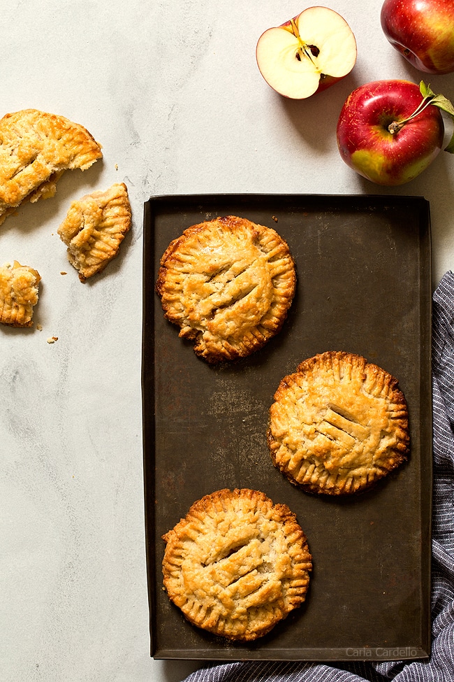 These small batch Apple Hand Pies made with pie crust are a taste of fall in every bite! This recipe freezes well, so you can make them ahead of time and bake when ready.